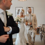 the bride walking up the aisle at the Suffolk registry office.