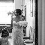 bury registry office shot of the bride leaving the ceremony with her daughter